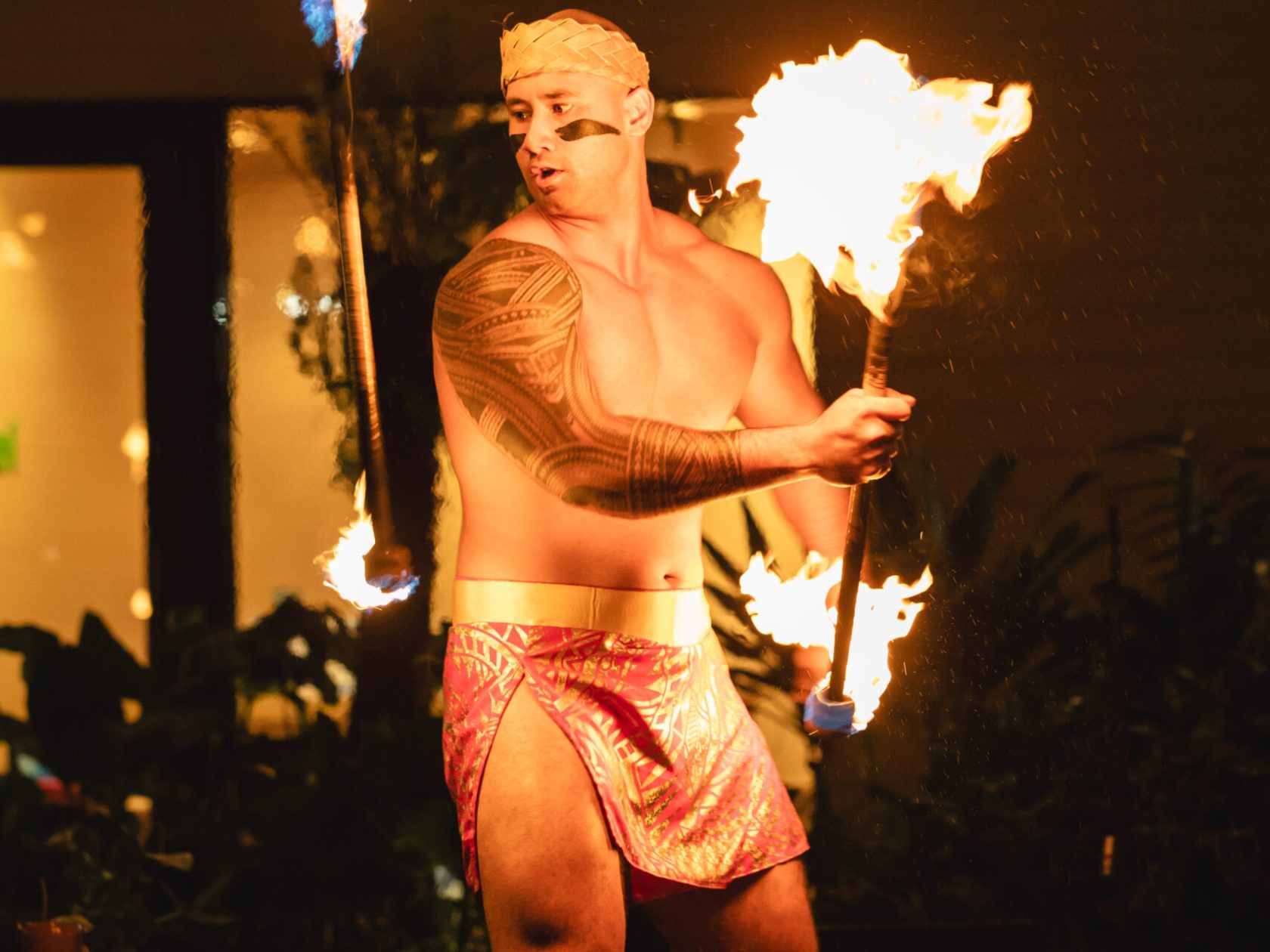 a person standing in front of a fire