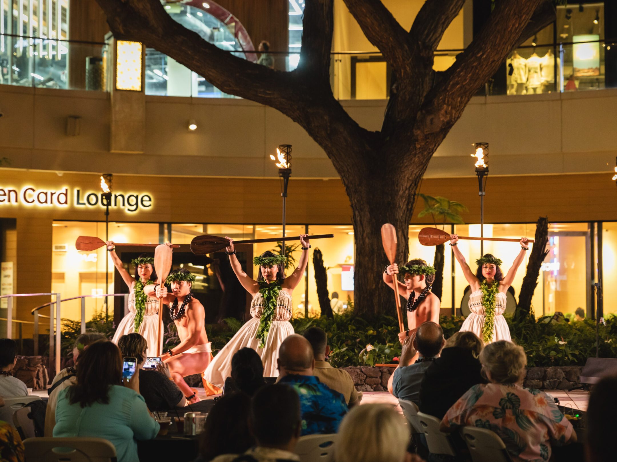 a group of people standing in front of a crowd