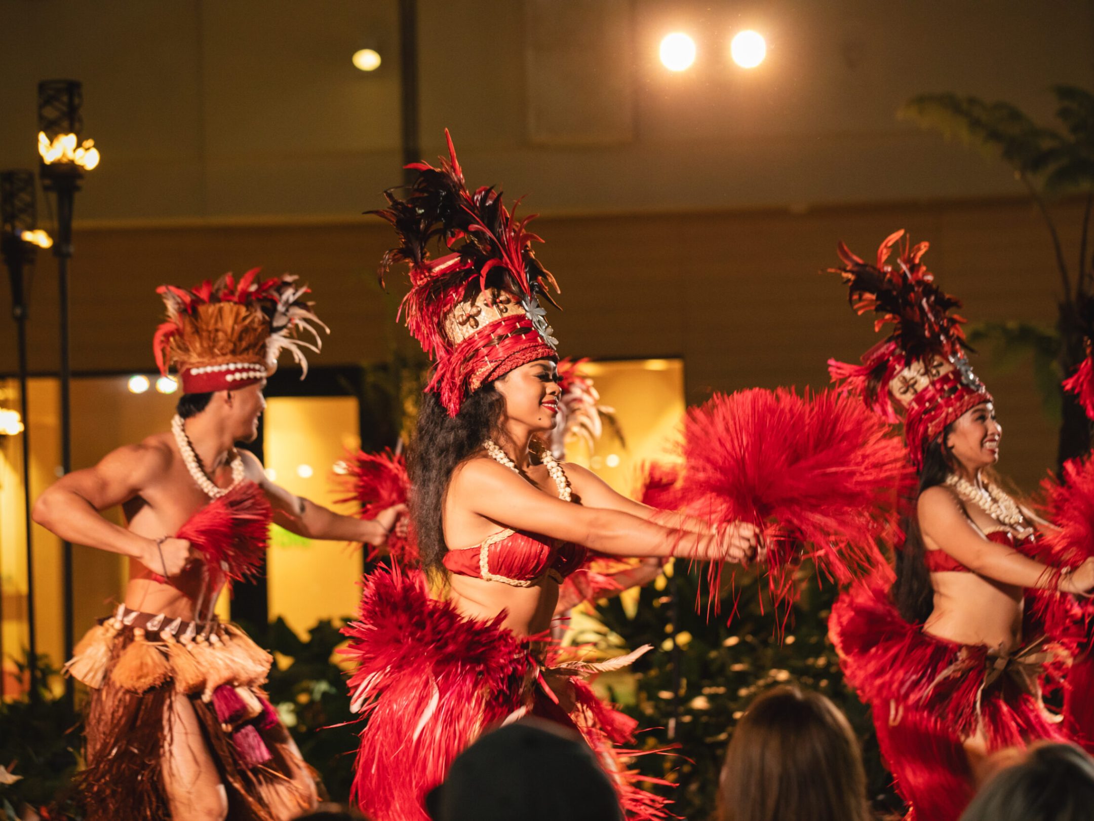 a person standing in front of a christmas tree