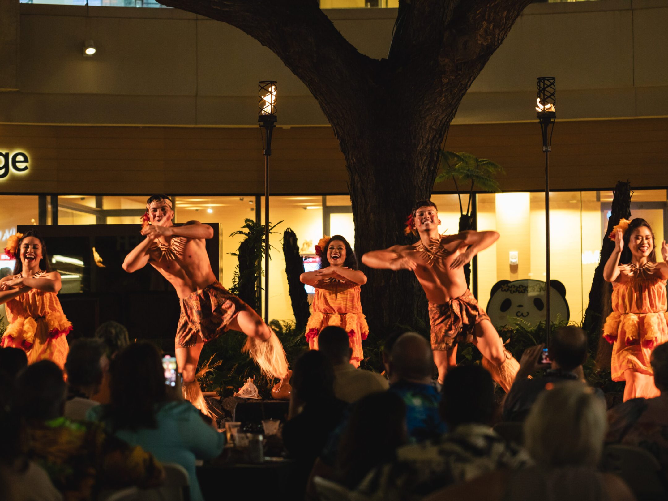 a group of people standing in front of a crowd